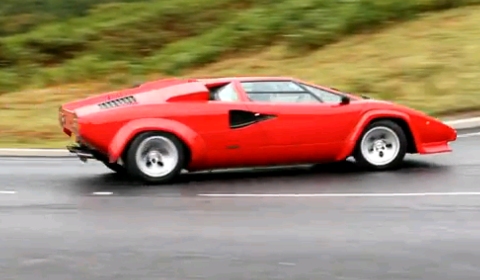 The video clip shows a red Lamborghini Countach drifting through a corner